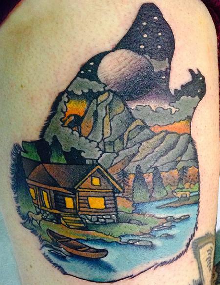 Gary Dunn - Traditional color cabin with lake and mountains in wolfs head tattoo, Art Junkies Tattoo Gary Dunn